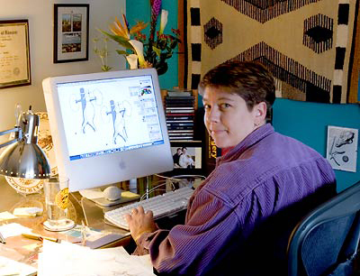 Holly Fischer, medical illustrator, working at her computer